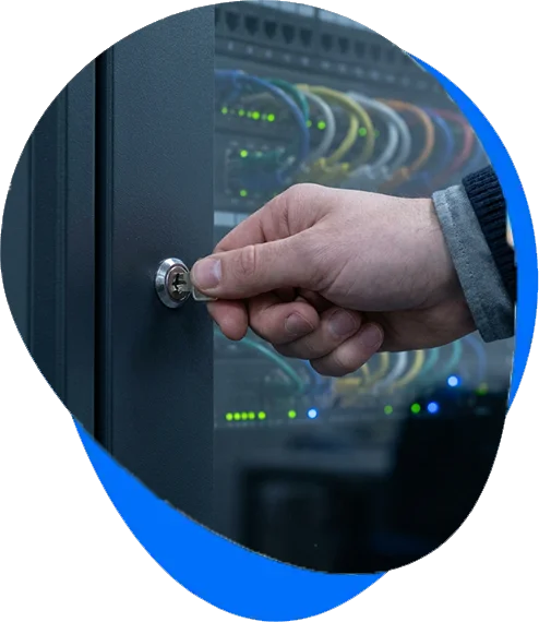Technician locking a network comms cabinet